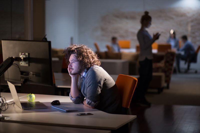young business owner working late at night